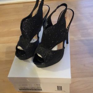 Black heels Size 7.  Never worn Still in box.
